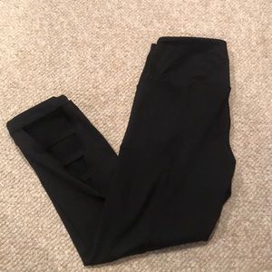 Capri length black athletic leggings with cut out